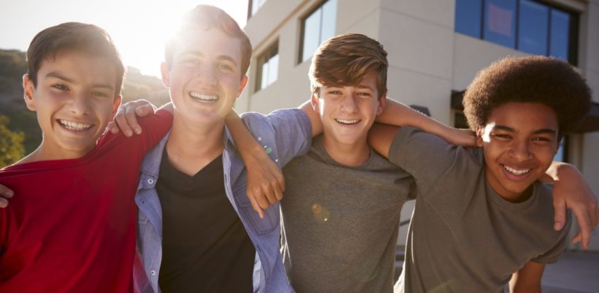 Portrait Of Male High School Student Friends Outside College Buildings